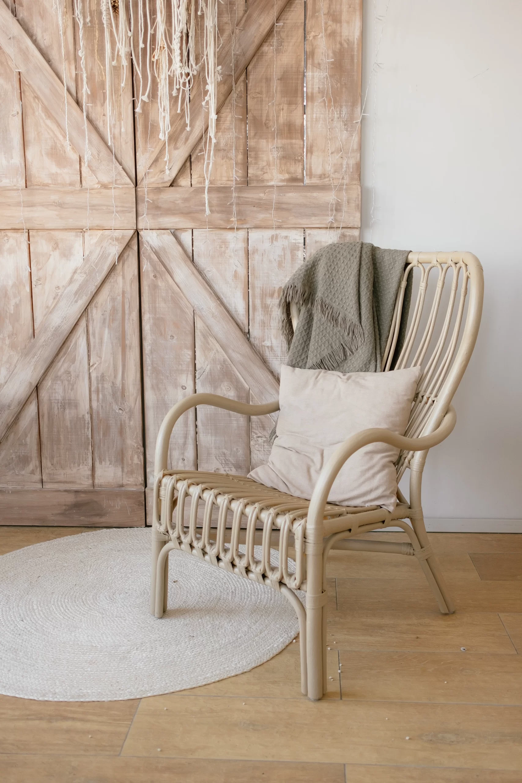 bamboo chair with cushion and blanket
