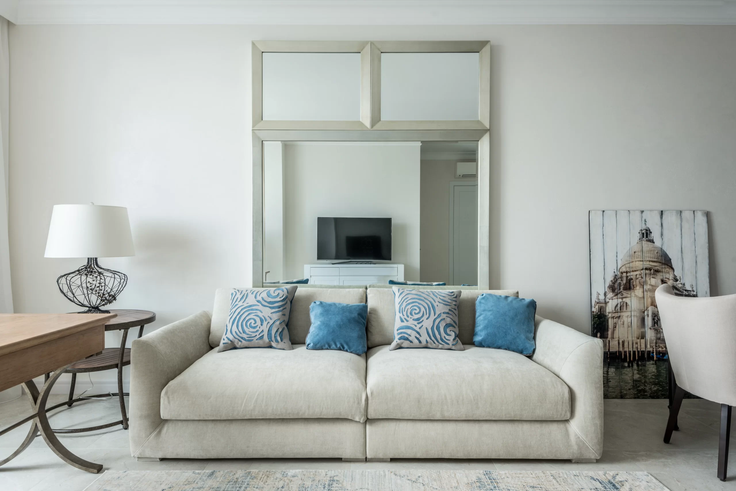 grey sofa with blue cushions