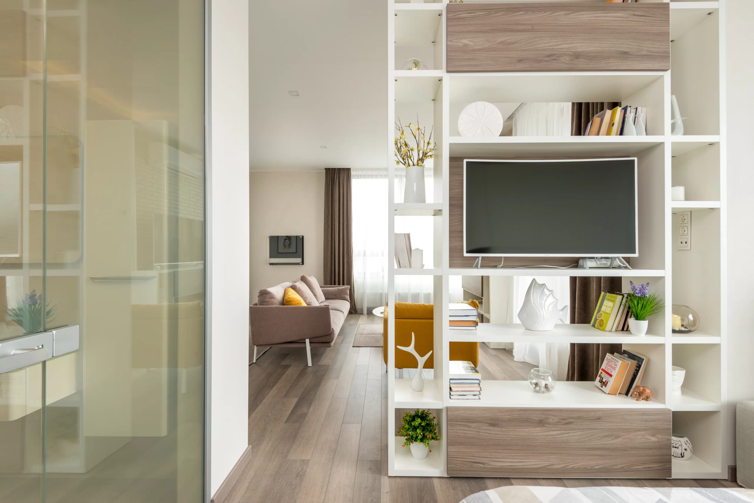 living room with organized shelving units 